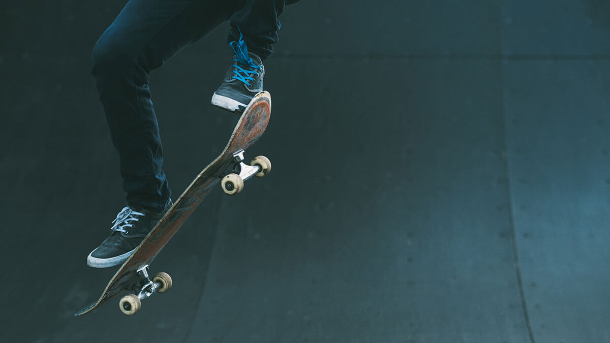 Skateboarder repeating flatground ollie drills